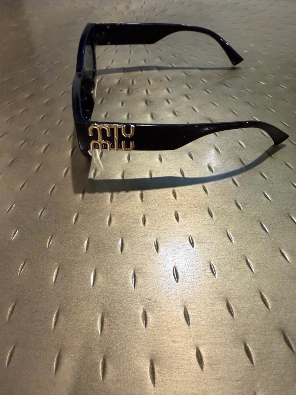 Miu Miu Black Sunglasses with Gold Logo Accent